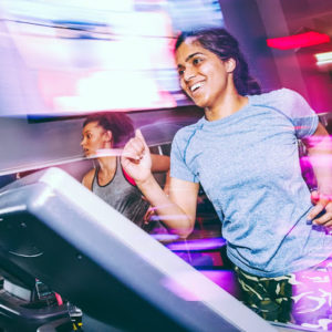 indian woman running on treadmill