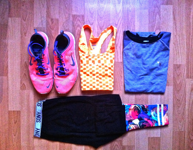 trainers, sports bra, t shirt and leggings folded